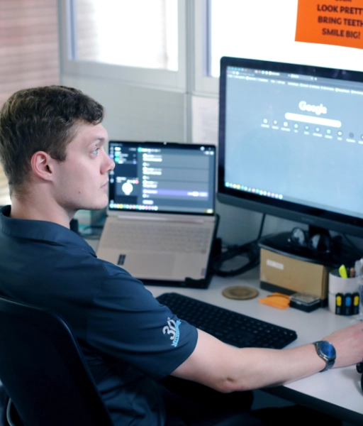 D-best team member at desk on computer providing IT Support for Fort smith