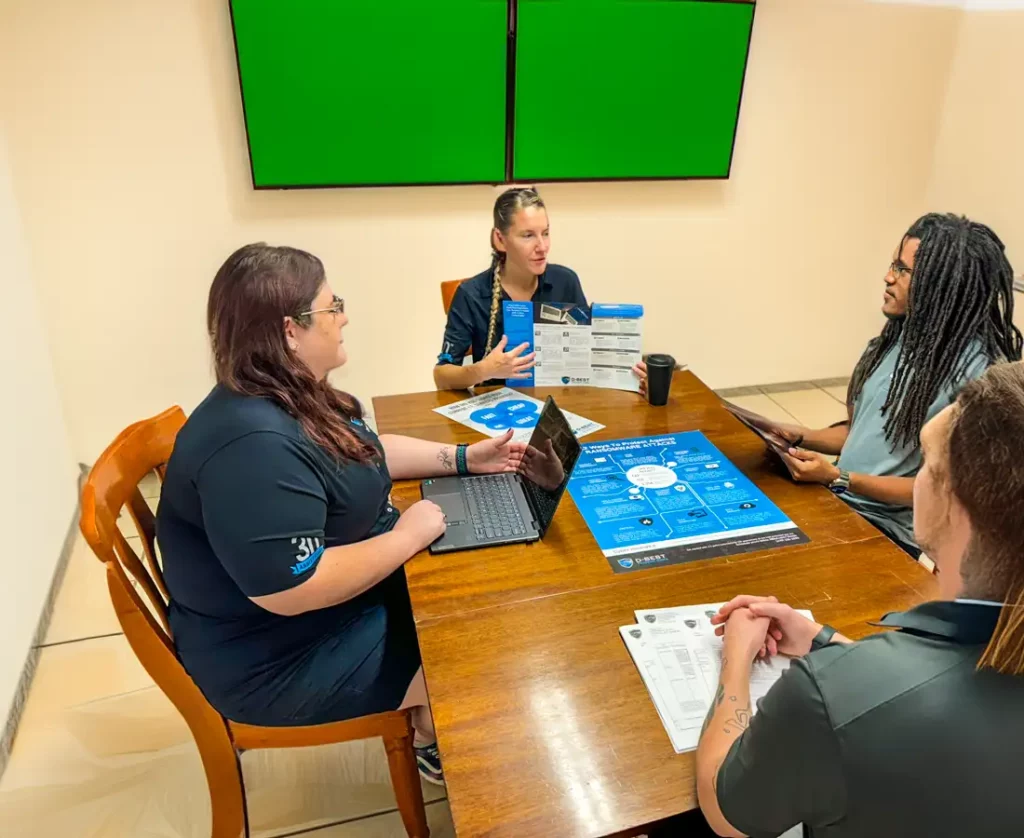 D-best employees in a meeting discussing marketing collateral
